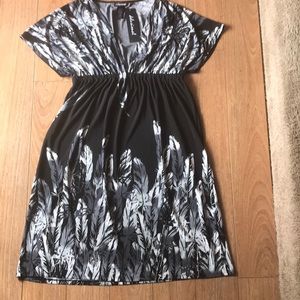 Woman’s summer dress with feathers